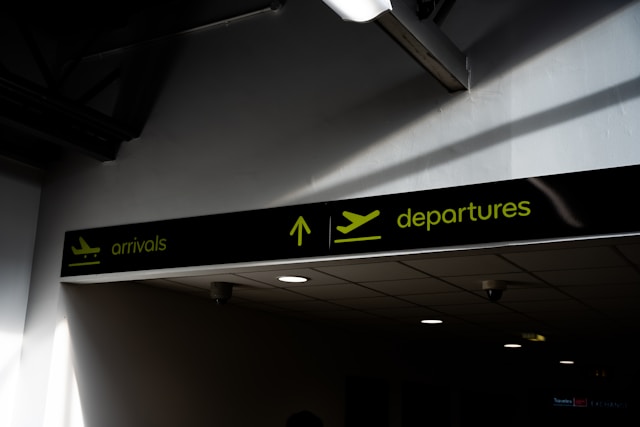 qu4klz478xc-1 a black and green sign hanging from the side of a wall