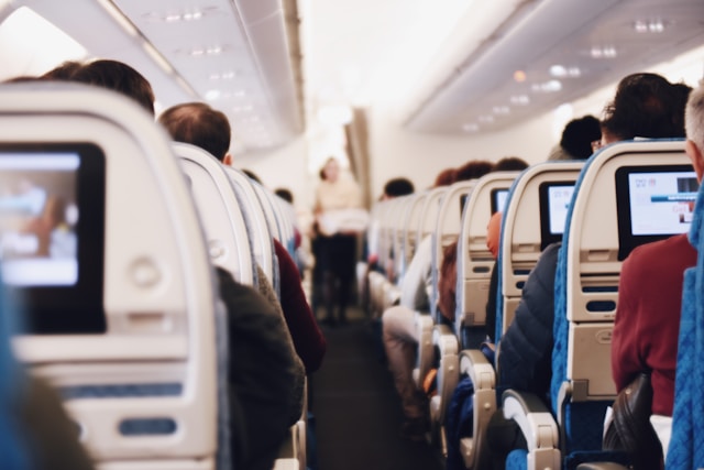 ttfdmarq-fe-1 shallow focus photography of people inside of passenger plane